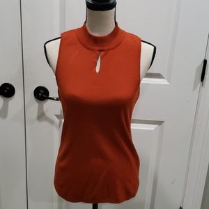 Burnt orange sleeveless turtleneck